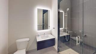 a bathroom with a sink toilet and a shower