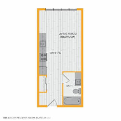 A floor plan of a small apartment with a living room, bedroom, kitchen, and bathroom.
