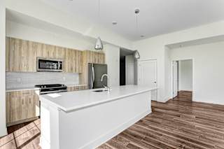 Modern hallway with recessed ceiling lighting at Inwood at Renaissance Square Apartments, Marlton