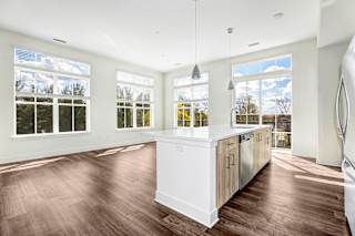Open concept kitchen and living area with large windows at Inwood at Renaissance Square Apartments, Marlton, 08053