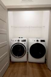 Front load washer and dryer in laundry nook at Allure Apartments, Indiana
