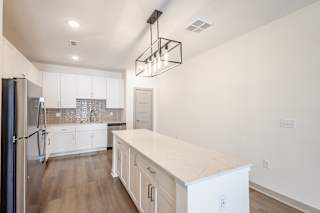 Modern kitchen island with drawers and countertop at Allure Apartments, Whiteland, 46184