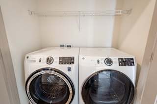 Front load washer and dryer with overhead storage at Allure Apartments, Whiteland, Indiana