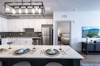 A modern kitchen with a large island in the middle.