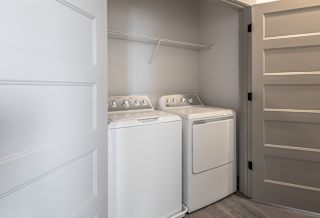 Two white washing machines in a laundry room. at Arbour Place Apartments, Indiana, 47130