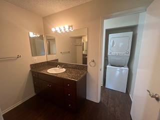 a bathroom with a sink and a washer and dryer