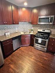 a kitchen with a stove and a microwave