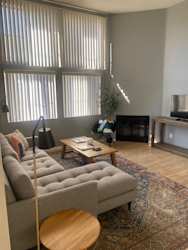 a living room with a couch and a tv