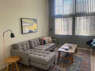 a living room with a couch and a table