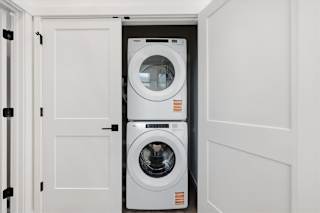 Front loading machines in laundry room at Alante Homes at Spring Run, Caldwell