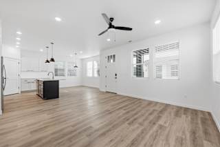 Spacious room with ceiling fan and wooden floor at Alante Homes at Spring Run, Caldwell, Idaho