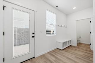 Vacant room with a bench at Alante Homes at Spring Run, Caldwell, ID