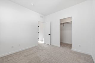Spacious and vacant room with carpeted floor at Alante Homes at Spring Run, Idaho, 83607