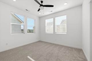 Room with multiple windows and carpeted  floor at Alante Homes at Spring Run, Caldwell, ID, 83607