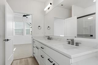 White Bathroom with large mirror at Alante Homes at Spring Run, Idaho