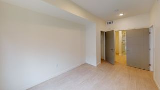 A room with a wooden floor and white walls. at Paperbox Lofts Apartments, Apartments, Salt Lake City  , UT