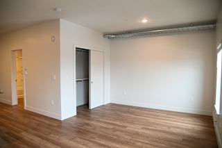 A room with a door and a window.