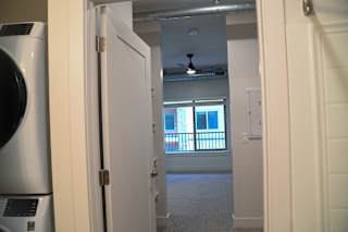 A view of a room through an open door.
