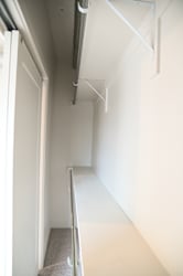 Narrow hallway with sloped ceiling and exposed pipe at The Revival Apartments, Salt Lake City, UT 84101