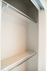 Empty closet with shelf and hanging rod at The Revival Apartments, Salt Lake City, UT