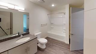 A bathroom with a toilet, sink, and bathtub. at Paperbox Lofts Apartments, Salt Lake City  , UT, 84101