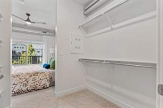 A bedroom with a bed, a window, and a fan. at The Revival, Salt Lake City