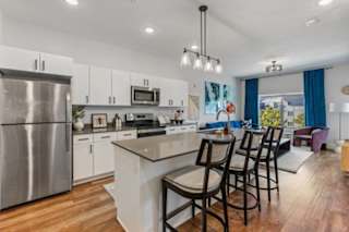 A modern kitchen with counter and stainless steel appliances. at The Revival, Salt Lake City