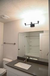Bathroom with undermount sink and shower tub combo at The Revival Apartments, Salt Lake City, 84101