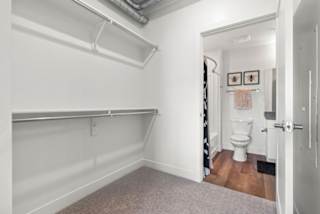 A white bathroom with a toilet and a door.