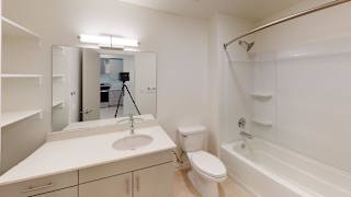 A white bathroom with a sink, toilet, and bathtub. at Paperbox Lofts Apartments, Utah, 84101