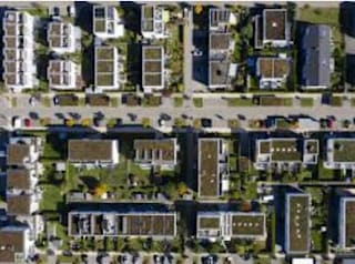 an aerial view of a neighborhood with houses and trees