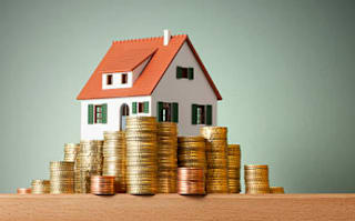 a house sitting on top of a stack of coins