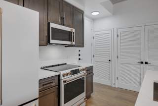 a kitchen with a stove and a microwave