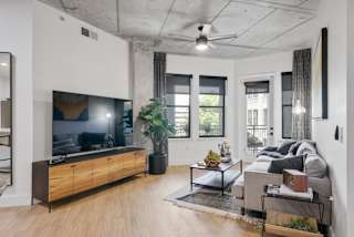 a living room with a couch and a tv