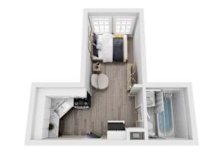 A top down view of a small apartment with a bed, a toilet, a sink, a shower, a microwave, and a fridge.
