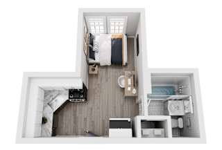 A top-down view of a small, neatly organized apartment with a bed, a desk, a kitchenette, and a bathroom.