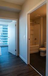 A bathroom with a toilet, sink, and bathtub.