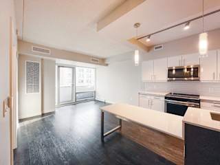 a kitchen and dining area in a 555 waverly unit