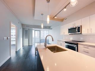 a kitchen with white countertops and white cabinets