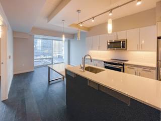 a kitchen and living room in an apartment