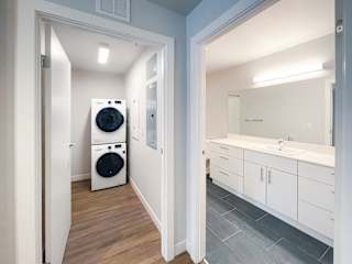 a bathroom with a washer and dryer