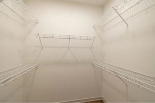 Empty white shelves in a room.