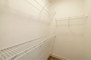 Empty wire shelving in a room.