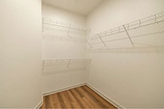 Empty room with white walls and wooden floor.