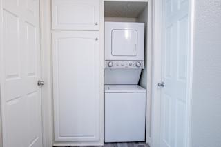 a small laundry room with a washer and dryer