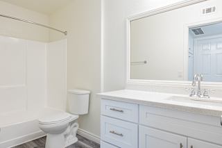 a bathroom with a toilet sink and bathtub