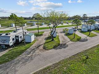 A sunny day at the RV park with a clear blue sky.