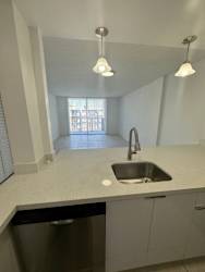 A kitchen with a sink and a window.