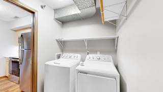 A laundry room with a washer and dryer.