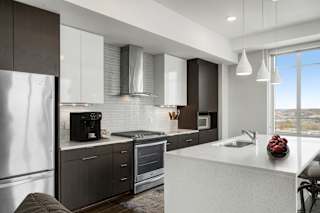 Fitted Kitchen With Island Dining at Custom House, Minnesota, 55101
